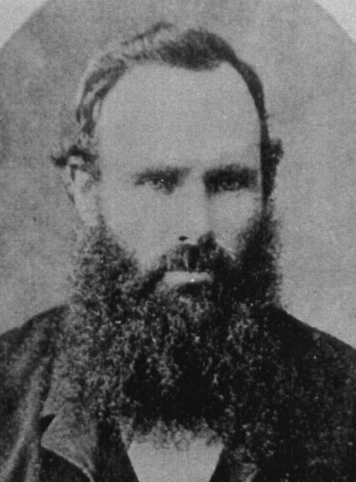 A formal portrait of Joseph Laurie showing his head and shoulders. He wears a dark vest and jacket over a white shirt. 